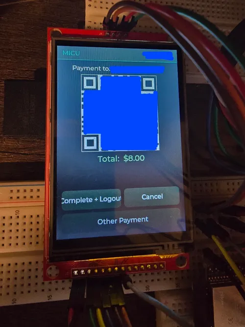Payment screen running on real hardware, showing a QR code and an $8.00 total